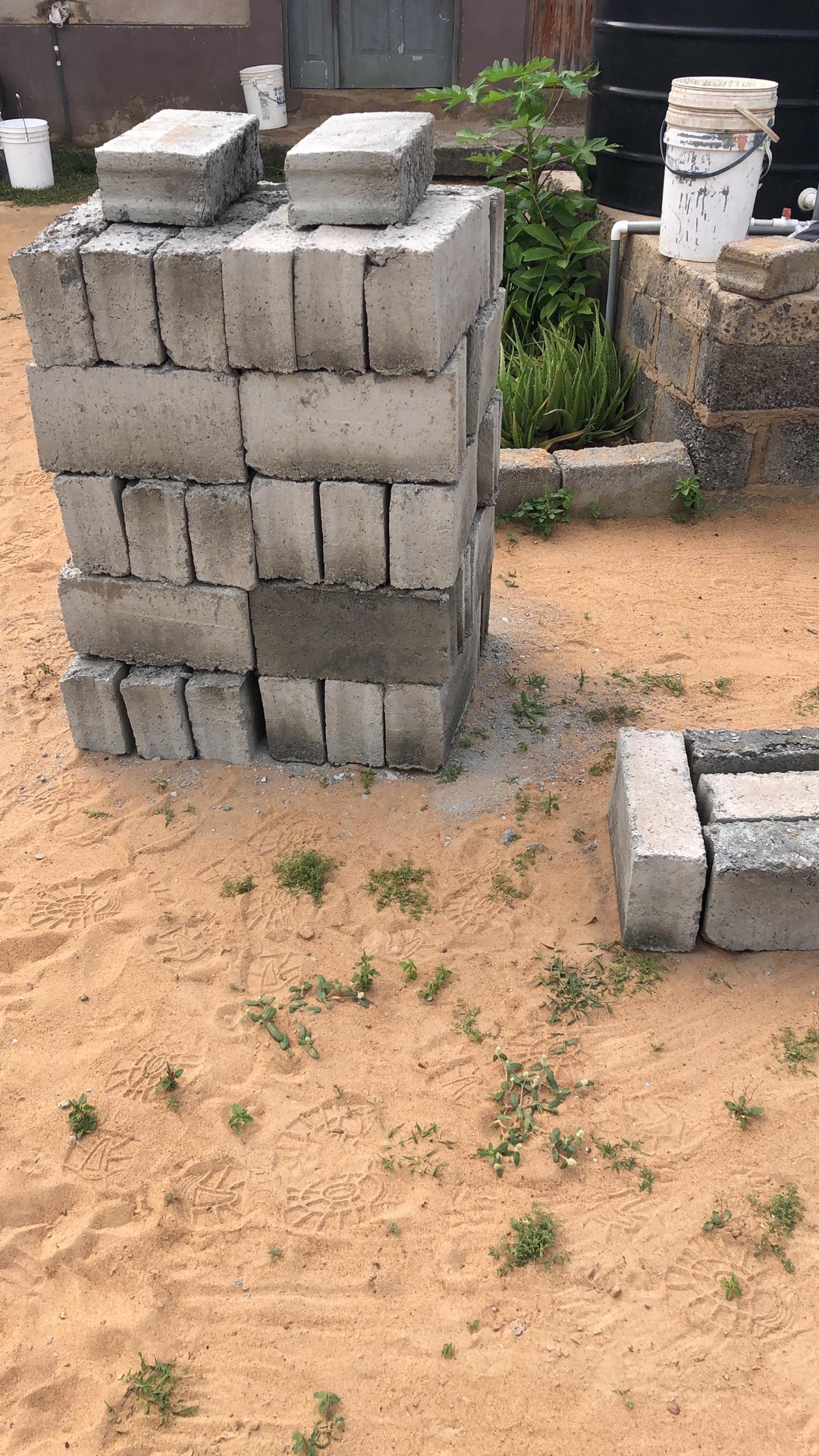 Cured concrete masonry units made with recycled PET flakes