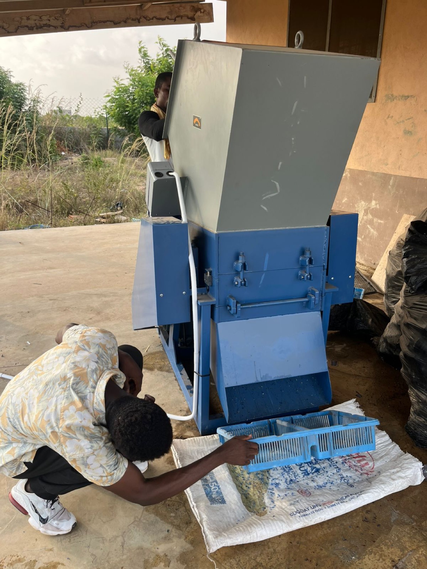 The shredder turning bottles into flakes
